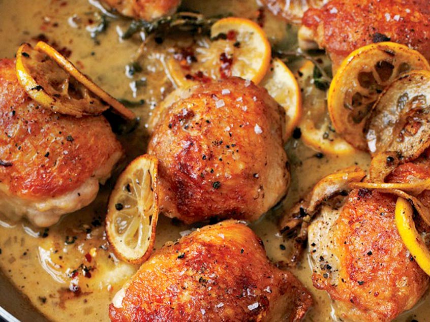 Cooking chicken thighs in a pan