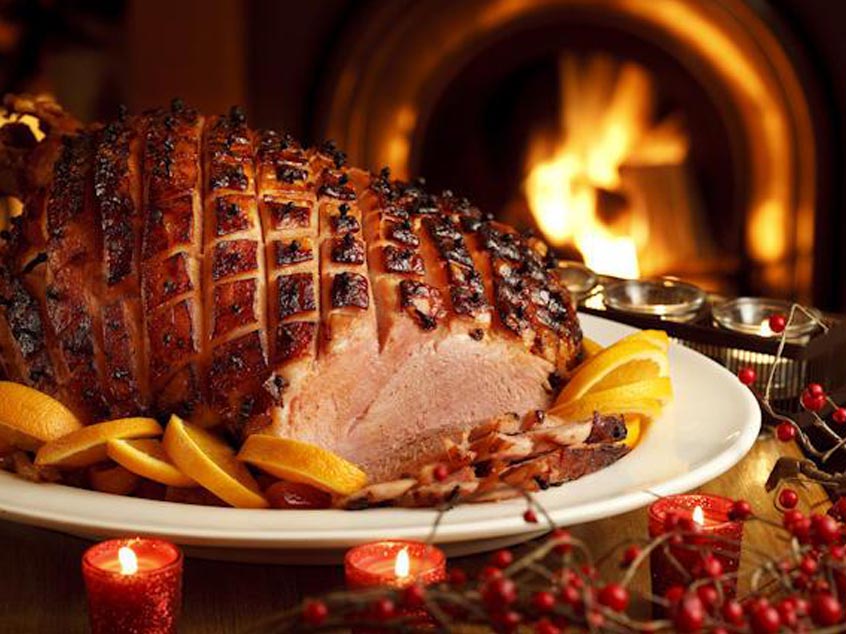 Christmas ham in front of a fire